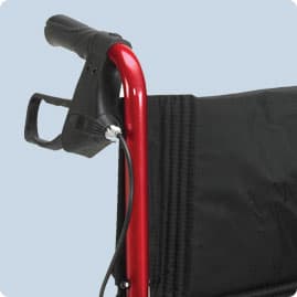 brakes located on the handlebars of a transport wheelchair